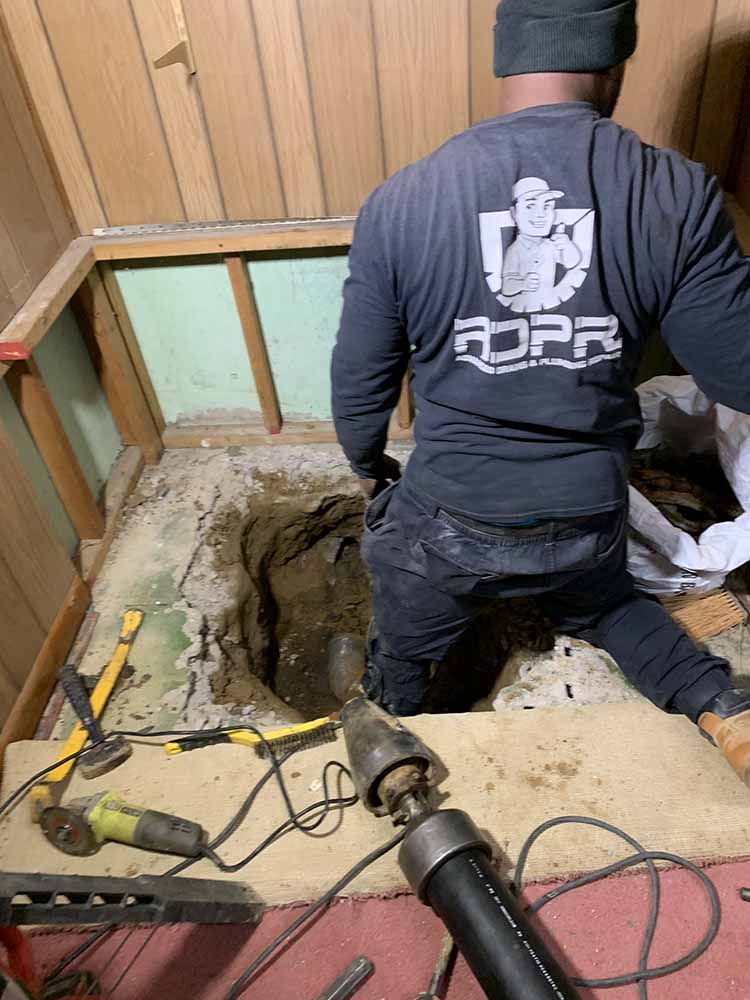 a finished trenchless pipe / trenchless pipe repair in progress